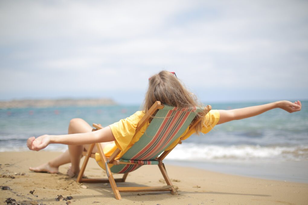 photo-of-woman-reclining-on-wooden-folding-chair-3785562 (1)